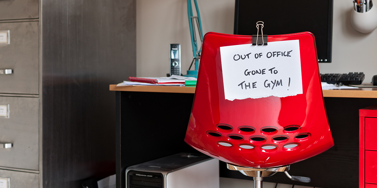 A chair that says "Out of Office Gone to the Gym"